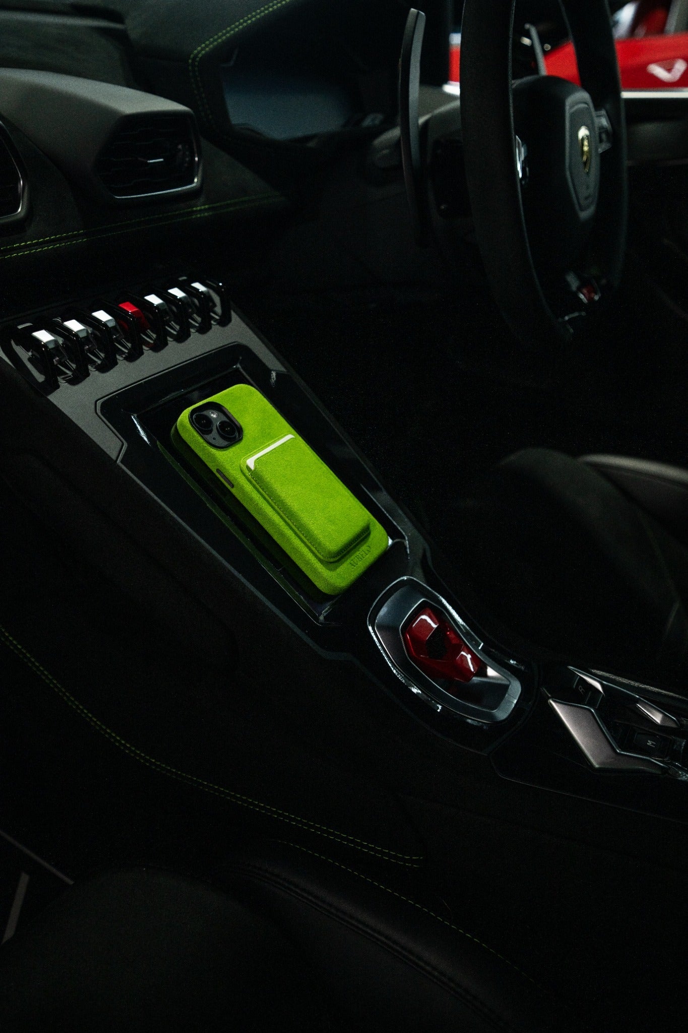AURÊLO Alcantara iPhone case in Evergreen colourway in Lamborghini centre console